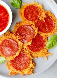 keto pepperoni and cheese crispes on a white plate