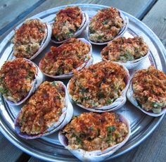 a plate full of deviled eggs sitting on top of a wooden table