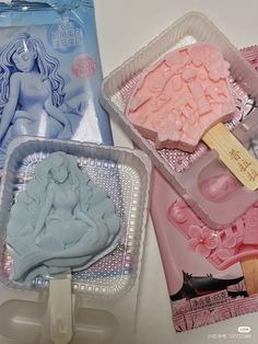 three plastic trays filled with different types of cake decorating tools and icing