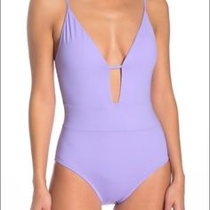 Color : Wisteria A Plunge Front And Scoop Back Add Flirty Style To A Lightly Padded One-Piece Swimsuit. Fit: Swimwear Sizing Is Smaller Than Apparel Sizing; Order One Size Up. - Plunge Neck - Adjustable Straps - Back Ties - Soft Cups - Scoop Back - Lined - Imported Fiber Content 83% Nylon, 17% Spandex Care Hand Wash Cold Additional Info Model's Stats For Sizing: - Height: 5'9" - Bust: 34" - Waist: 23" - Hips: 35" Model Is Wearing Size S. Nwot, Never Worn, Sanitary Lining In Place V-neck Cutout Swimwear For Pool, Chic V-neck One Piece For Pool, Low-cut Beachwear Swimwear For Spring, Spring Low-cut Beachwear Swimwear, Elegant Purple Swimwear For Vacation, Purple Backless Swimwear For Vacation, Backless Purple Swimwear For Vacation, Purple V-neck Swimwear With Lined Body, Low-cut Beach Bodysuit For Summer