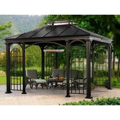 an outdoor gazebo with chairs and tables under it