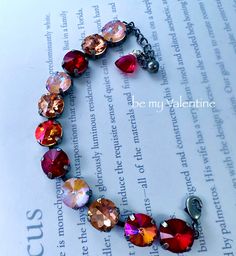 - This bracelet is stunning, full of stunning fabulous color, expensive stones and elements, a beauty! ~ this new stunning cup rhinestone bracelet features large 12 mm high quality expensive multi faceted  crystals in stunning red crystal, mystic peach opal crystal, apricot dazzling crystal, and a volcano crystal, with a lobster closure and a teardrop of multi faceted drop of stunning red topaz -this measures 7.25-8.2 inches, please note to have adjusted  - fabulous color combo!! this is breathtaking on, with expensive stones, stunning light, and so much artisan appeal ~ so eye catching, super funky and very boho chic, fresh and flirty and a perfect every day bracelet, enjoy Expensive Stones, Red Topaz, Jewelry Crystal, Rhinestone Bracelet, Rhinestone Jewelry, Red Crystals, Opal Crystal, Faceted Crystal, Crystal Bracelet