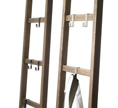 two wooden ladders with hooks on them and a white towel hanging from the top