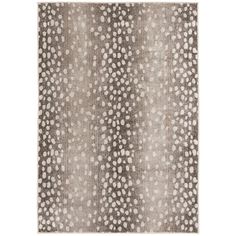 a gray and white rug with dots on it