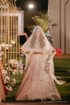 the bride is walking down the aisle in her wedding dress