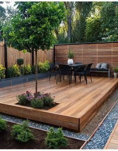 a wooden deck surrounded by plants and trees in a backyard with seating area on the other side