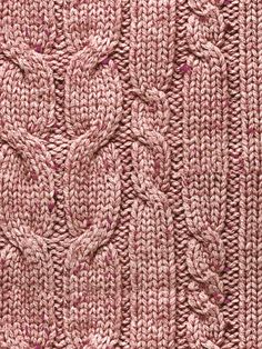 an image of a knitted sweater with leaves on the front and back side, in shades of pink