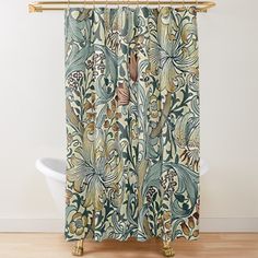 a shower curtain with an ornate design on the front and back panels, featuring leaves and flowers