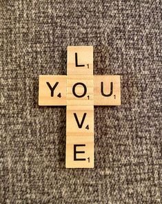 a wooden cross that says i love you