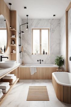 a bathroom with marble walls and flooring, white bathtub next to a large window