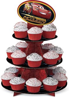 a three tiered cupcake stand with red frosting and cars logo on top