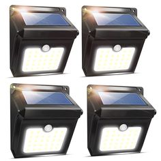 four solar powered motion sensor lights with white light shining on the front and back of them