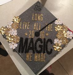 a graduation cap that says, long live all the magic we made with flowers on it