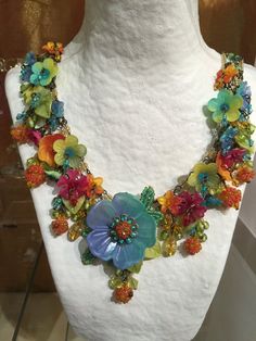 Dripping with colorful hand-painted flowers and glass beads, what a perfect necklace to make you feel like your on a holiday in Havana. This necklace has multi colored flowers of turquoise, yellow, orange and red. A unique and bright fun color combo. It measures almost 20 inches with a 4 inch extender so as you may adjust the length as needed. We use findings that are nickel free. This is a hand beaded piece of jewelry. All the work is hand sewn or wired without the use of glue. This heirloom qu Multicolor Bohemian Flower Necklace For Crafts, Multicolor Bohemian Flower Necklace For Jewelry Making, Bohemian Multicolor Flower Necklace For Jewelry Making, Bohemian Flower Necklace For Parties, Multicolor Bohemian Jewelry With Flower Design, Multicolor Bohemian Flower Jewelry, Multicolor Bohemian Flower Necklace, Bohemian Multicolor Flower Necklace, Multicolor Flower-shaped Jewelry With Flower Decoration