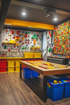 an indoor play room with legos on the wall