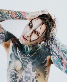 a man with lots of tattoos on his body