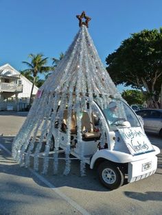 a golf cart is decorated with ice and snow flakes to look like a christmas tree