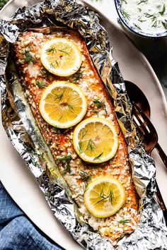 baked salmon with lemons and herbs on foil