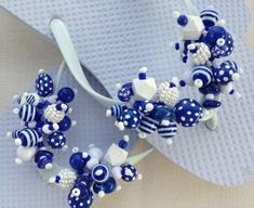 I call this pair of flip flops Sailing. Marine blue and white fun mix of beads on white flip flops. Fun summer accessory. Great gift! ALL flip-flop designs are available on a variety of different flip-flop colors for the asking! Fun White Flip Flops For Beach, Fun White Flip Flops For The Beach, Fun White Flip Flops For Vacation, Summer White Flip Flops For Pool, White Summer Pool Flip Flops, Adjustable White Flip Flops For Beach Season, White Summer Flip Flops As Gift, White Flip Flops As Summer Gift, Blue Fun Flip Flops For Vacation