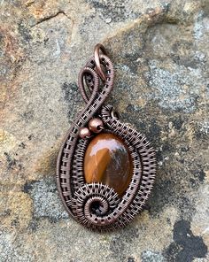 Two Tone Orange Agate Pendant in layers of wire wrapped copper. Hanna Design, Orange Agate, Copper Accents, Copper Pendant, Wire Weaving, Copper Pendants, Agate Pendant, Wire Wrapped, Two Tone