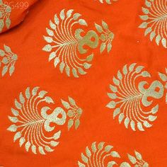 Indian Orange Banarasi Brocade Bridal Wedding Dress by the Yard Brocade Banaras Blended Silk jacket Bridesmaid Skirts Table Runner fabric. This is beautiful Varanasi brocade fabric in twin shade, brocade fabric has large motifs design in Orange and Gold.  ➤Product: Brocade Fabric ➤Fabric Type: Blended Silk (Viscose and Silk) Fine quality Zari Brocade Weaving from Banaras ➤Color: Orange and Gold ➤Width: 44 inches. ➤Condition: New  ➤Code: bg499 ➤Listing for 1 Yard of fabric. ➤Care: Dry Clean Only You can use this fabric to make Dresses, Tops, Blouses, Jackets, Crafting, Clutches or Evening Bags, Embellish your clothes, Pillows, Drapery, Home Décor, Outdoor, Quilting, Sewing, General, Upholstery etc use it for scrap booking projects. If you purchase more than 1 Yard you will get it in running Unstitched Wedding Fabric With Pallu Detail, Festive Wedding Fabric With Pallu Details, Wedding Sets In Brocade With Traditional Patterns, Festive Orange Choli With Motifs, Art Silk Fabric For Wedding And Festivals, Festive Orange Motif Choli, Wedding Fabric With Motifs For Navratri, Wedding Art Silk Fabric With Motifs, Traditional Drape Fabric For Wedding Festivals