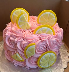 a cake decorated with lemons and pink icing