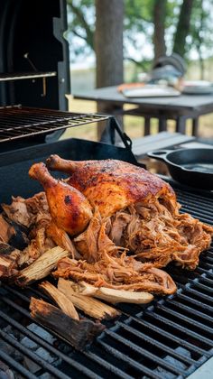 a chicken is being cooked on the grill