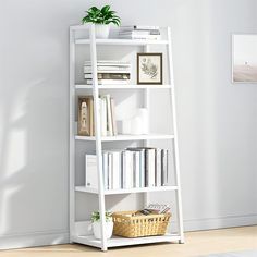 a white book shelf with books and plants on it in the corner of a room