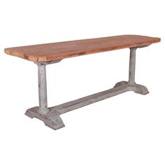 an old wooden table with metal legs on a white background for display or montage