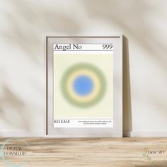 an art print with the words angel no 999 in blue and green on it