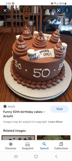 a cake that is sitting on top of a table with the number 50 written on it