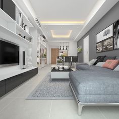 a modern living room with grey couches and white shelves on either side of the tv