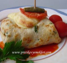 a close up of food on a plate with tomatoes