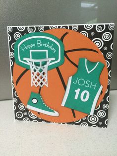 a birthday card with an image of a basketball jersey and shoes