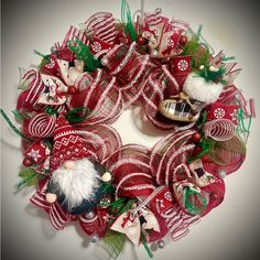 a christmas wreath with santa claus and other decorations