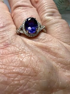 Gemstone: genuine natural oval cut purple blue iolite Size of stone: 9mm x 7mm x 5mm Weight: 1.67cts approx Accent stones: round cut white sapphires Metal: .925 stamped Sterling Silver, rhodium plated Size: 8 Ring weigth: 3.4g Purple Band, White Sapphire, Solitaire Ring, Oval Cut, Rhodium Plated, Silver Fashion, Round Cut, Blue And Purple, Jewelry Rings