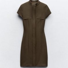 New With Tag Zara S/S 2024 Collection Round Neck Mini Dress With Short Sleeves. False Welt Pockets At Chest. Interior Lining. Front Zipper Closure Hidden By A Flap. Dark Khaki 2245/717 Outer Shell 92% Polyester 8% Elastane Lining 100% Polyester Which Has At Least: Lining 100% Rcs-Certified Recycled Polyester Outer Shell 92% Rcs-Certified Recycled Polyester Clothing Care Guide Hand Wash Max 30c/86f Do Not Use Bleach / Whitener Iron Maximum 110c/2309f Do Not Dry Clean Do Not Tumble Dry Chic Fitted Dress With Stand Collar, Fitted Midi Dress With Stand Collar For Work, Fitted Midi Dress With Stand Collar, Casual Fitted Dress With Stand Collar, Elegant Brown Mini Dress With Short Sleeves, Fitted Stand Collar Dress For Workwear, Zara Short Sleeve Dresses For Work, Zara Short Sleeve Work Dresses, Zara Short Sleeve Workwear Dresses