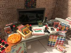 a table topped with pizza boxes and other items