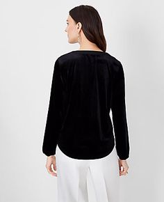 Elevate your wardrobe with the Ann Taylor Velvet Mixed Media Pleat Front Top, a masterful blend of style and comfort. This top features a unique pleated V-neck and a contrasting texture design with a woven front and sleeves paired with a knit back, ensuring both elegance and ease.

- Size: XS
- Color: Black
- Gender: Female
- Material: Body - 92% Polyester, 8% Spandex; Collar - 100% Polyester
- Fit: Relaxed fit
- Length: 26 1/2 inches long
- Sleeve Type: Long sleeves with elasticized cuffs
- Car Black Pleated Top For Fall, Casual Pleated V-neck Tops, V-neck Pleated Top For Workwear, Pleated V-neck Top For Work, Ann Taylor Petite, V Neck Shirts, Knitted Suit, Hip Style, Chic Top