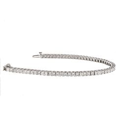 Indulge in the timeless elegance of our 14K White Gold 7 Carat Princess Cut One Line Tennis Bracelet. This exquisite piece is meticulously crafted in 14K white gold and adorned with a dazzling array of 7.70 carats of princess cut diamonds. Every diamond is carefully selected for its exceptional brilliance and fire, creating a captivating sparkle that will mesmerize onlookers.Designed to be worn effortlessly from day to night, this tennis bracelet is 7 inches long, draping gracefully around your White Platinum Diamond Bracelet With Accents, Exquisite Platinum Tennis Bracelet With Diamond Accents, Luxury Platinum Diamond Bracelet With Brilliant Cut, White Platinum Diamond Jubilee Bracelet, White Platinum Jubilee Diamond Bracelet, Luxury Platinum Tennis Bracelet With Single Cut Diamonds, Classic Platinum Diamond Bracelet For Wedding, Luxury Platinum Diamond-cut Bracelet, Luxury Platinum Diamond Cut Bracelet