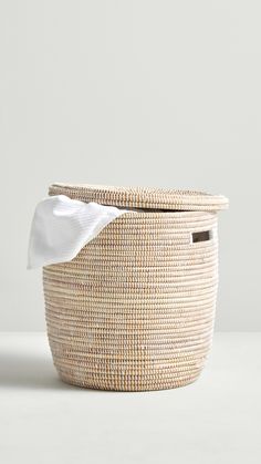 a woven basket with a white napkin in it