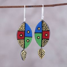 Crafted entirely by hand, these Bollywood-style ceramic dangle earrings from India are presented by Ritu Thapar. Each earring features an oval leaf-like shape, painted by hand in tones of blue, red, green, and gold. A golden leaf dangles beneath each earring, which swings from a hook of sterling silver. Shrink Plastic Jewelry, Ceramic Earrings, Vintage Jewelry Crafts, Golden Leaf, Hand Painted Earrings, Sparkly Jewelry, Hand Painted Jewelry, Ceramic Earring, Plastic Jewelry