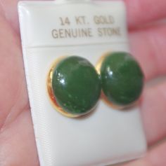 Welcome to my handmade shop: vintage gorgeous genuine 14k gf green jadeite jade round stud earrings diameter of round jade: 15 mm in largest area nice size pair 19 ct total gemstone stylish, affordable. they look just gorgeous and perfect size comfortable to wear vintage 1950's every pair is a bit different based on the nature of jade. gorgeous coloring on these carved dome shape jades. very cool looking. you will love wearing it. Vintage Hallmarked Green Earrings, Green Round Clip-on Earrings For Anniversary, Coral Roses, Coral Ring, Leverback Earrings, Round Stud Earrings, Bezel Setting, Handmade Shop, Vintage Shops