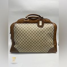 Gucci Luggage Bag With Beige Leather And Gucci Monogram Coated Canvas Yellow Cloth Fabric Lined Interior With 1 Interior Zip Compartment Gold Hardware/Lock And Key Luggage Tag All Zippers Are Functional Signs Of Wear Include- Worn Leather With Scuffs, Scratches, And Other Types Of Marks As Well As Tarnishing Zipper Which Is Functional And Zips Almost All The Way But Can Not Zip Far Enough To Clasp Into The Lock Which Is Visible In The Photos. Worn Handles, Interior Marks, And Other Normal Signs Gucci Luggage, Vintage Supreme, Gucci Vintage, Gucci Monogram, Luggage Bag, Cloth Fabric, Lock And Key, Luggage Tag, Luggage Tags