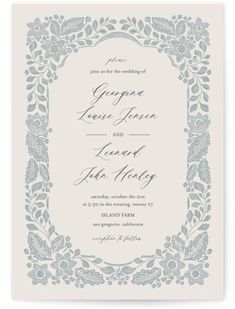 a wedding card with an ornate frame on the front and bottom, in blue ink