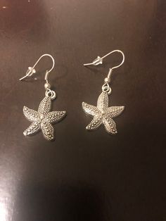 These silver earrings are beautiful starfish. The starfish are about 1 inch long.  Great gift for a loved one, that special starfish. Elegant Starfish Charm Drop Earrings, Elegant Handmade Starfish Earrings, Silver Ocean-inspired Earrings, Nickel-free Silver Ocean-inspired Earrings, Elegant Starfish Charm Earrings As Gift, Elegant Starfish Charm Earrings For Gift, Silver Starfish Jewelry For Beach, Nickel Free Silver Starfish Earrings, Nickel-free Silver Starfish Earrings