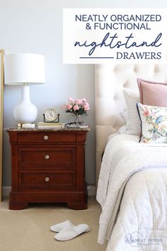 a bed room with a neatly organized and functional nightstand next to a night stand that has flowers on it