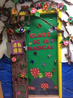 a classroom door decorated to look like a tree with the words class is magic written on it