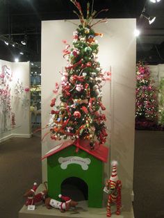 a christmas tree is on display in a museum