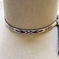 These western hatbands will definitely set off the western look on your favorite hat. Dress it up with this ½" tapestry hatband. The slip knots with end tassels easily adjusts for a snug fit. 
*Hat not included. Western Braided Hat Bands For Rodeo, Braided Western Hat Bands For Rodeo, Bohemian Black Hat Bands For Ranch, Adjustable Braided Western Hat, Western Style Adjustable Braided Hat, Traditional Adjustable Handwoven Hat Bands, Western Multicolor Hat Bands For Rodeo, Western Braided Hat Band For Ranch, Western Braided Hat Band For Festivals